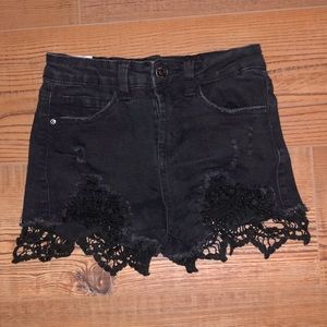 Almost Famous black ripped lace shorts